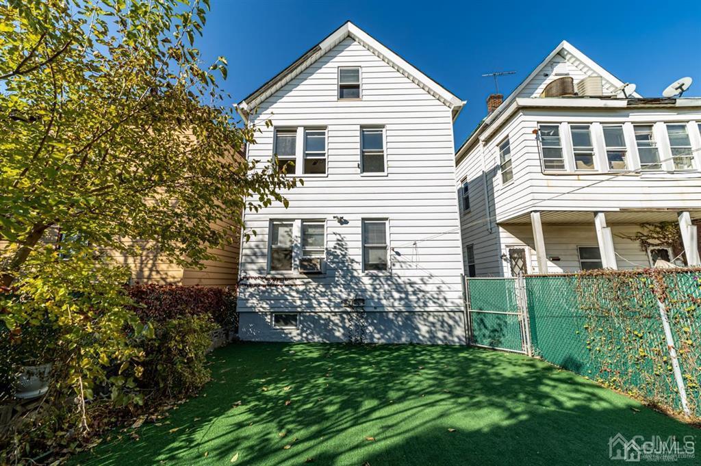 28 Niles Street Elizabeth, NJ 07202 - Photo 35 of 35 a front view of a house with a garden