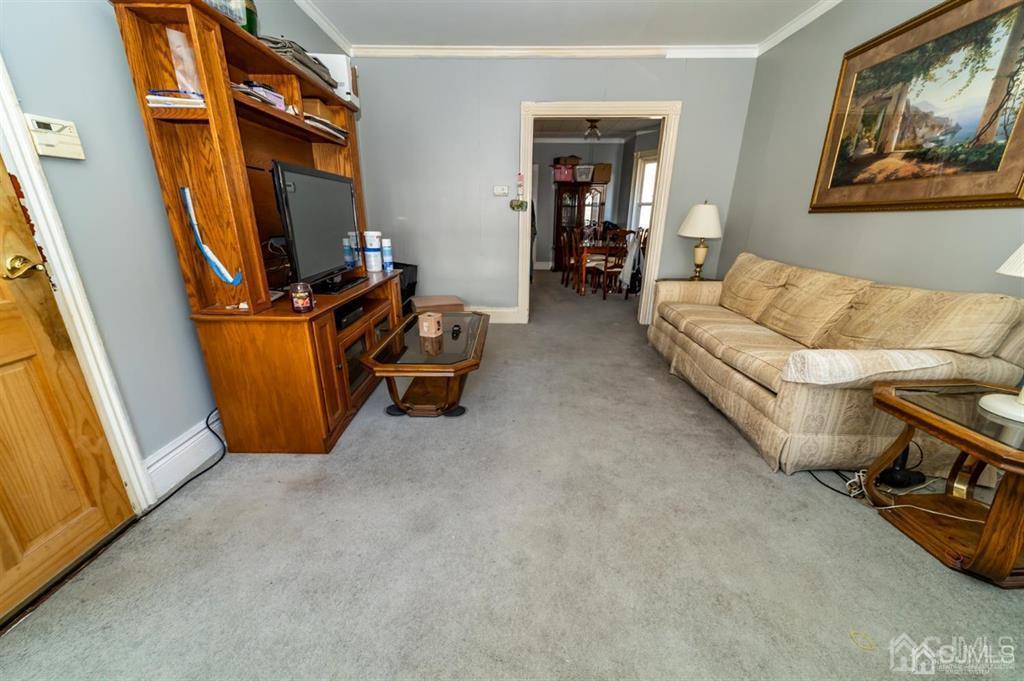28 Niles Street Elizabeth, NJ 07202 - Photo 5 of 35 a living room with furniture and a flat screen tv