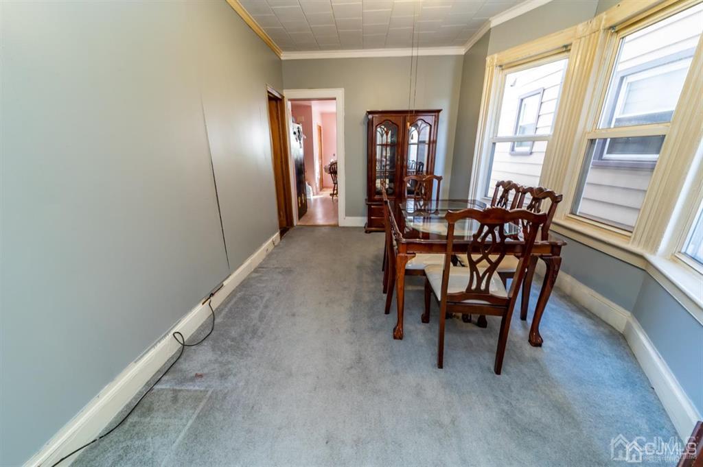 28 Niles Street Elizabeth, NJ 07202 - Photo 8 of 35 a dining room with furniture and window