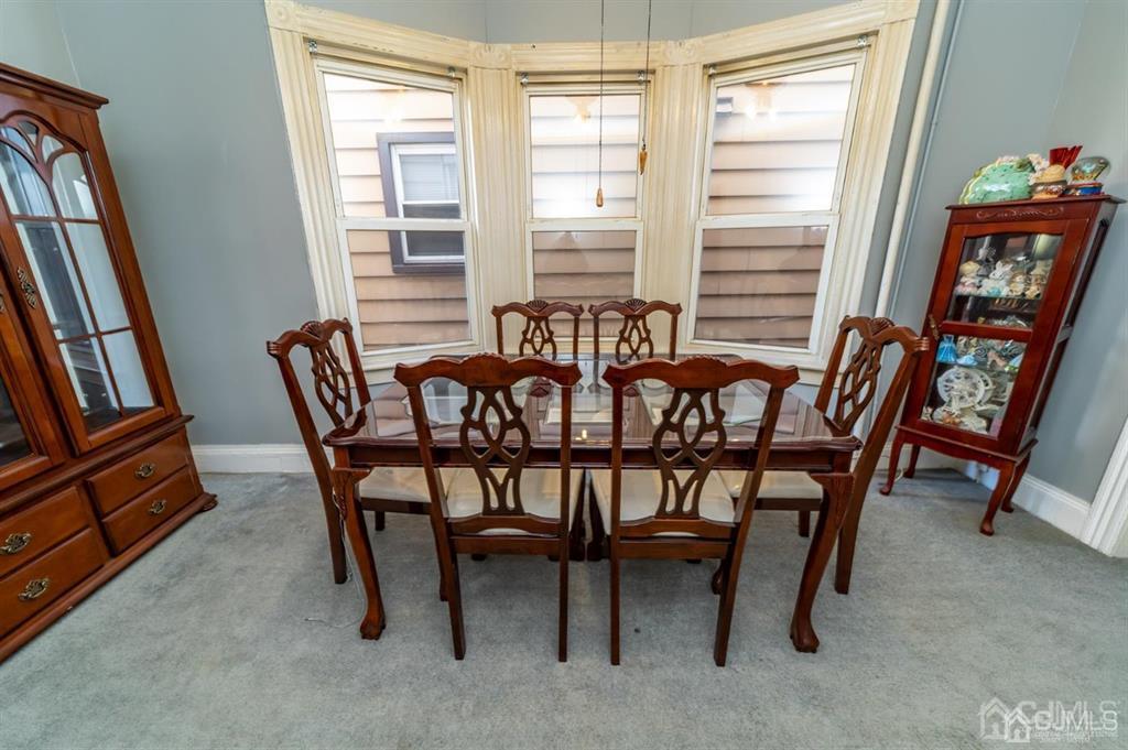 28 Niles Street Elizabeth, NJ 07202 - Photo 9 of 35 a view of a dining room with furniture and a window