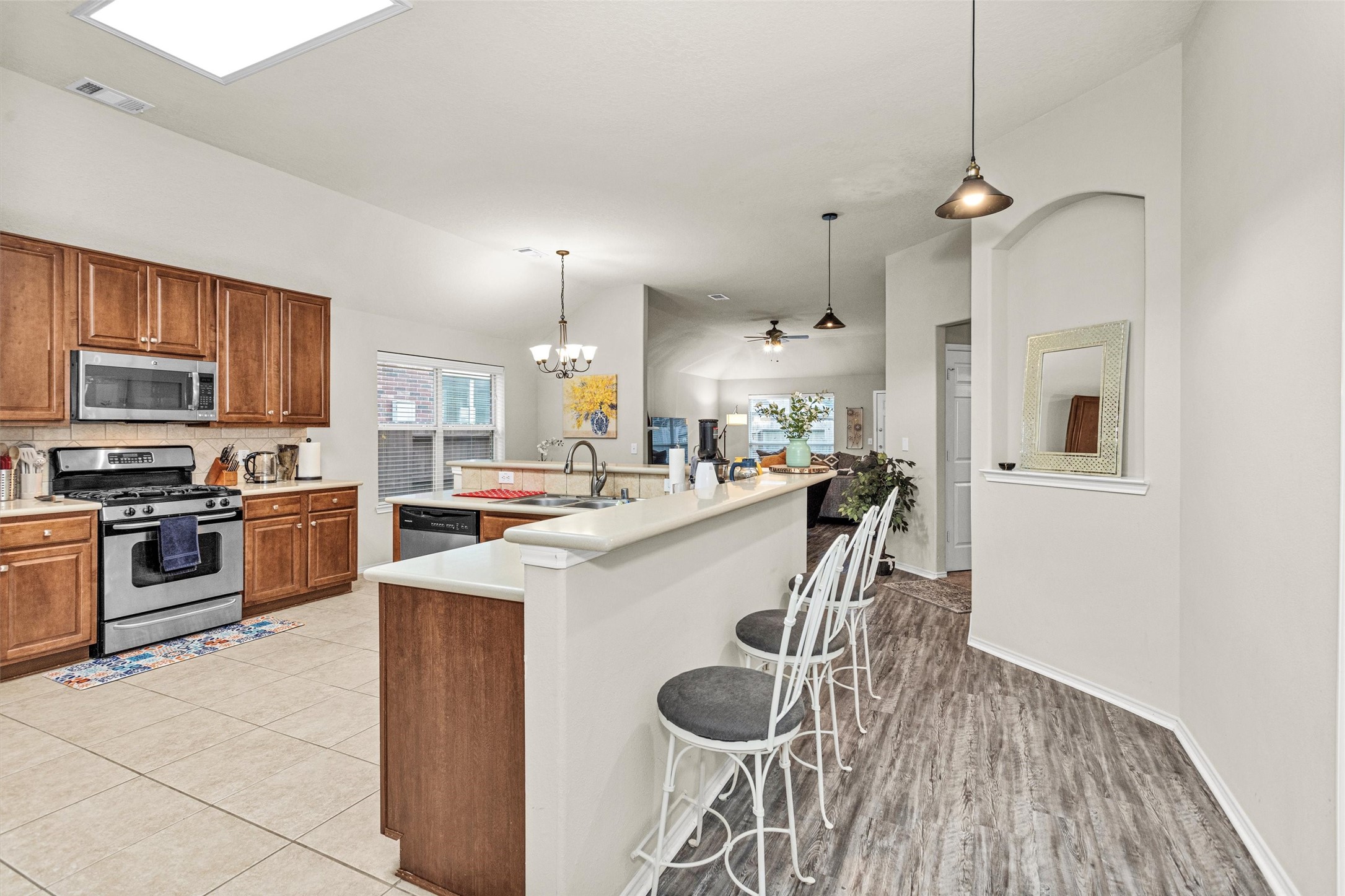 30406 Mesa Valley Drive Spring, TX 77386 - Photo 12 of 29 a kitchen with a sink a counter top space stainless steel appliances and cabinets