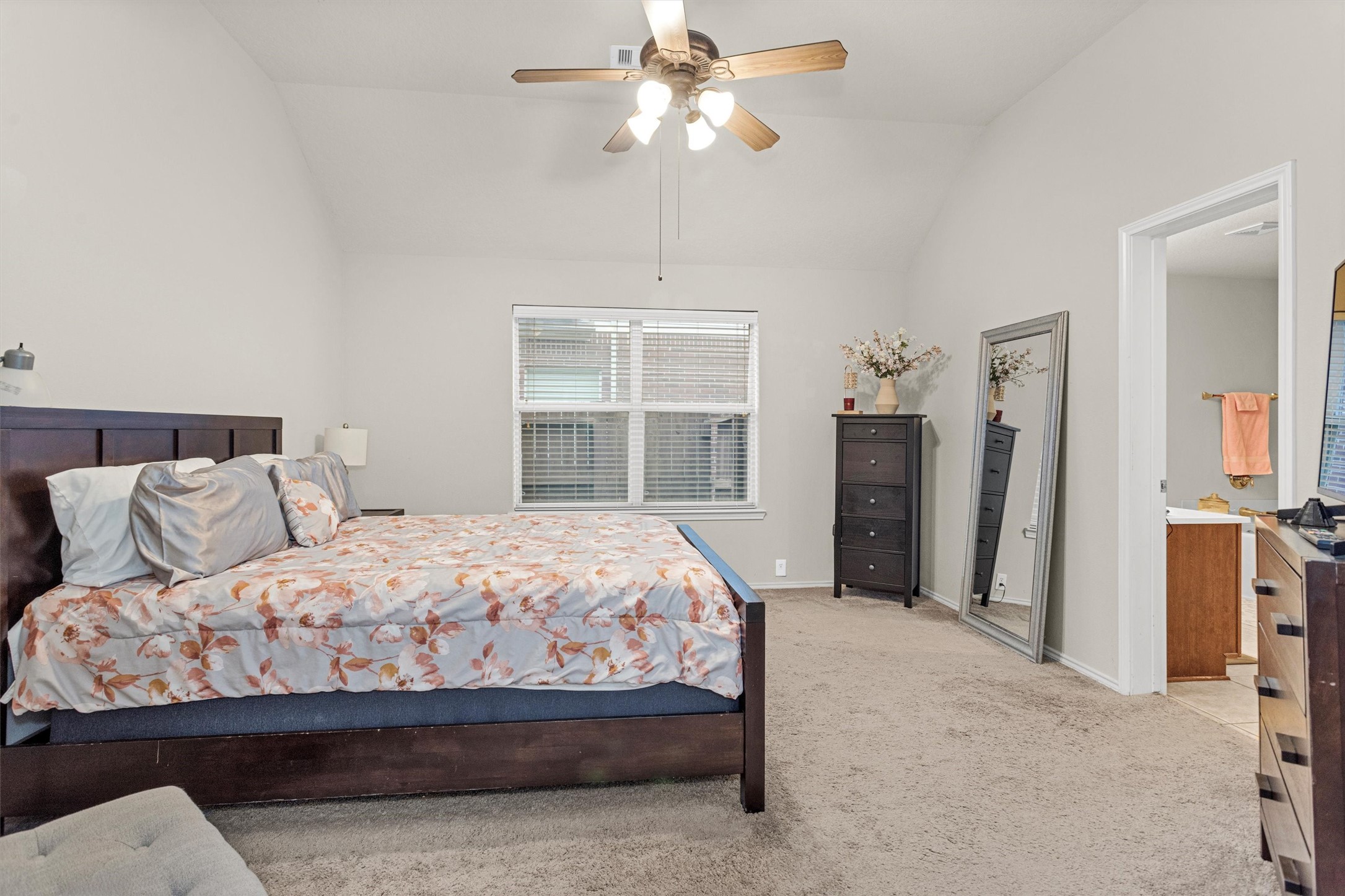 30406 Mesa Valley Drive Spring, TX 77386 - Photo 18 of 29 a bedroom with a large bed and a chandelier