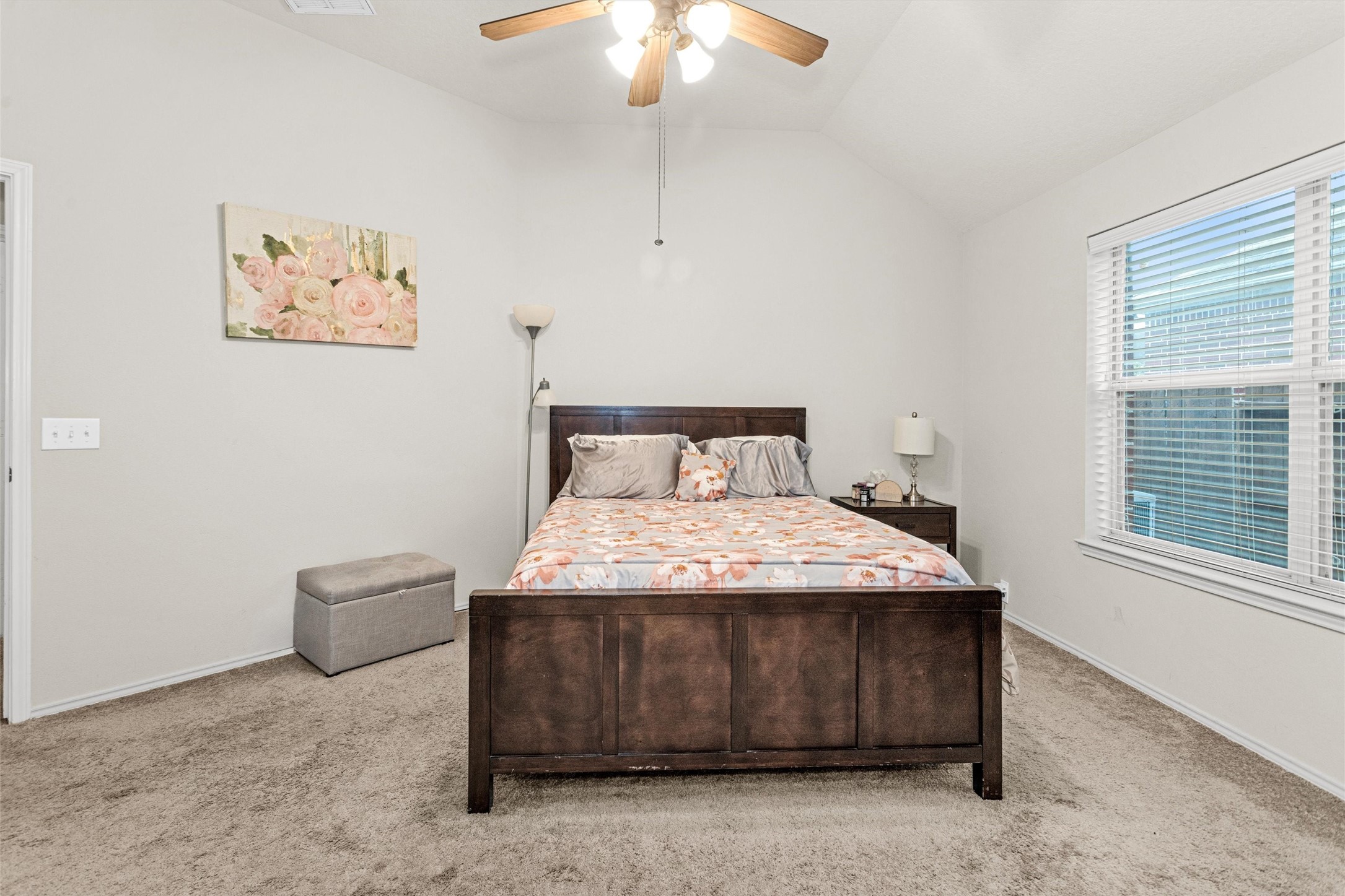 30406 Mesa Valley Drive Spring, TX 77386 - Photo 19 of 29 a bedroom with a bed and a chandelier