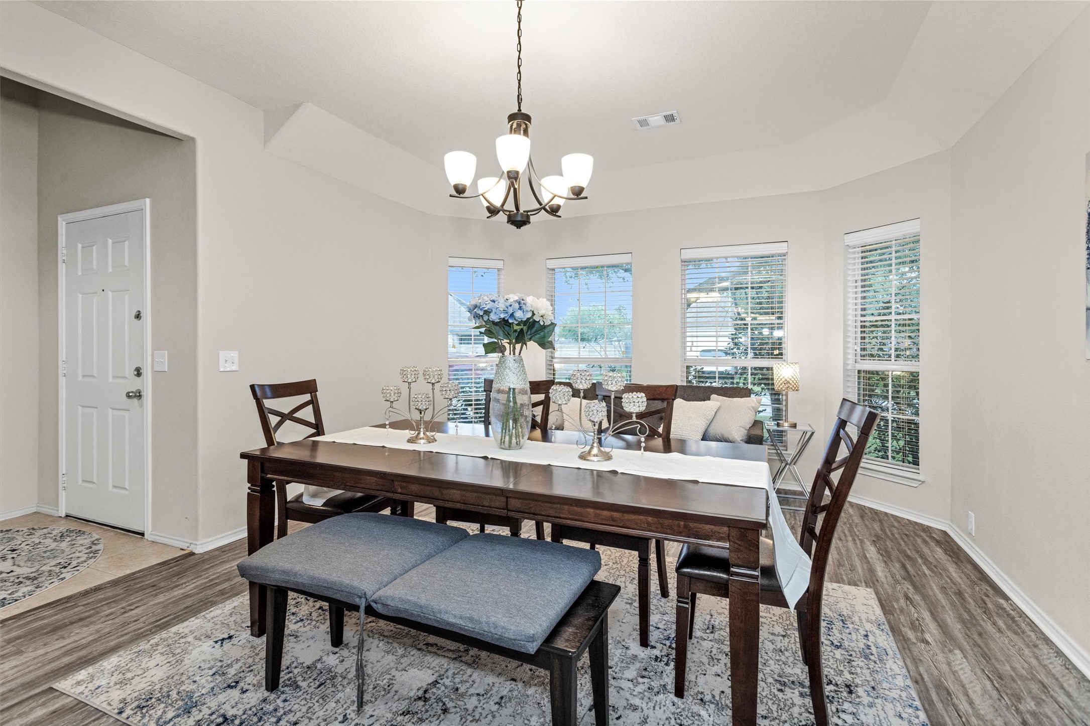 30406 Mesa Valley Drive Spring, TX 77386 - Photo 2 of 29 a view of a dining room with furniture a chandelier and wooden floor