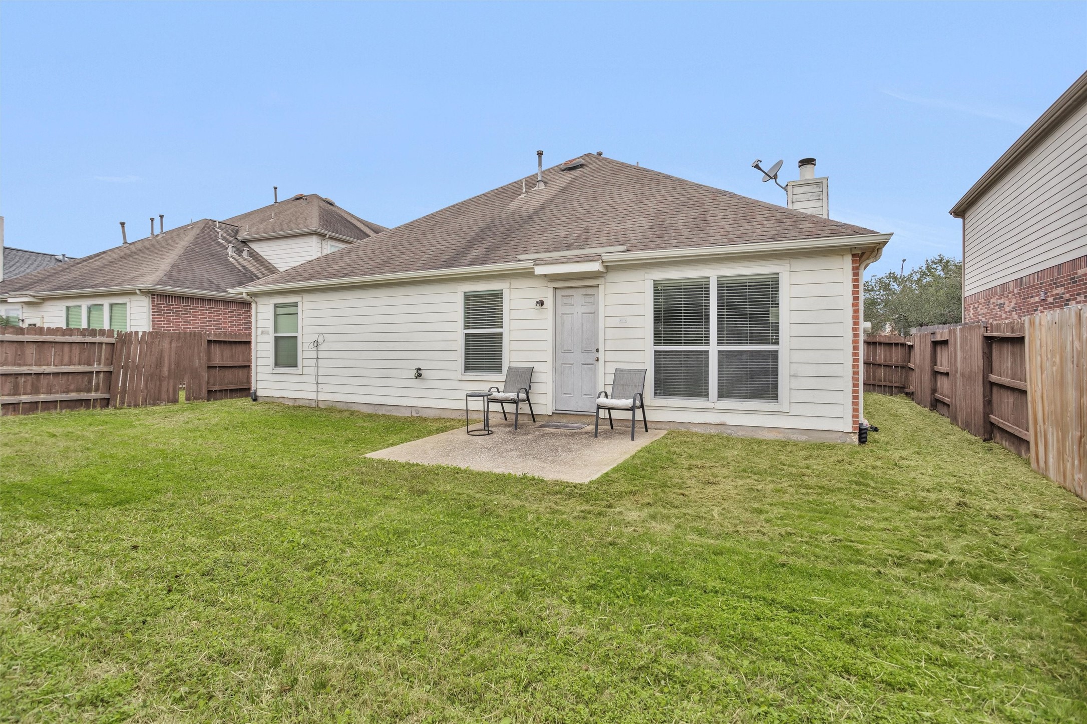 30406 Mesa Valley Drive Spring, TX 77386 - Photo 28 of 29 a view of a house with a backyard and a patio