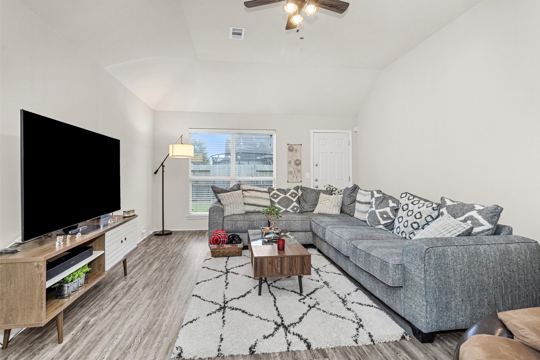 30406 Mesa Valley Drive Spring, TX 77386 - Photo 4 of 29 a living room with furniture and a flat screen tv