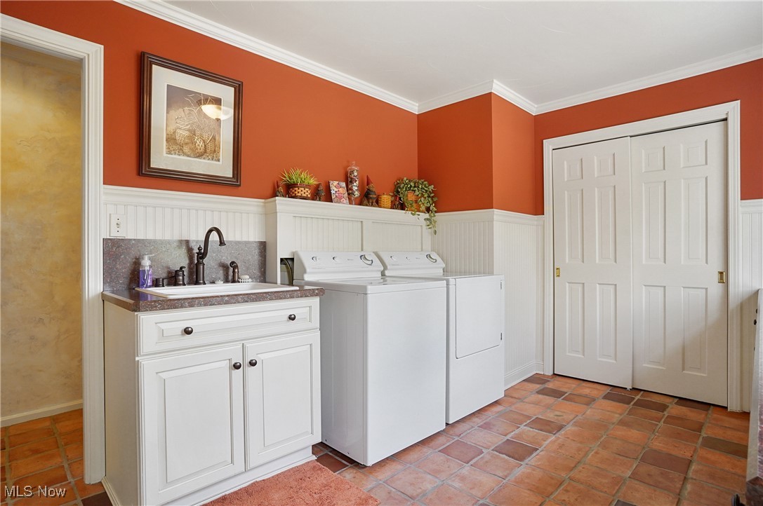 4432 Ira Road Akron, OH 44333 - Photo 16 of 50 Washroom featuring separate washer and dryer, wainscoting, crown molding, and cabinet space