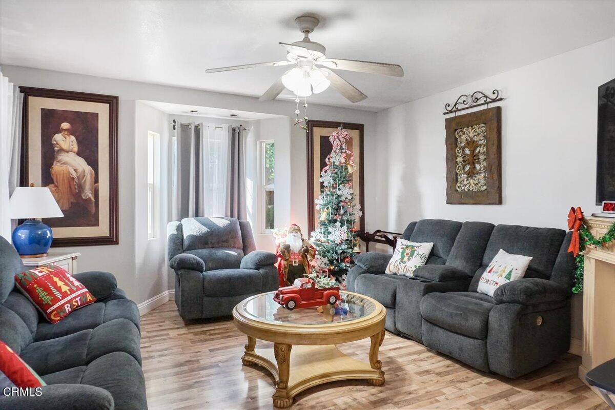 313 Rhodes Court Fillmore, CA 93015 - Photo 5 of 10 a living room with furniture and a large window