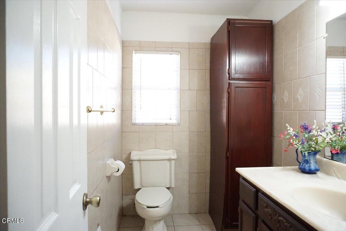 313 Rhodes Court Fillmore, CA 93015 - Photo 8 of 10 a bathroom with a sink toilet and shower