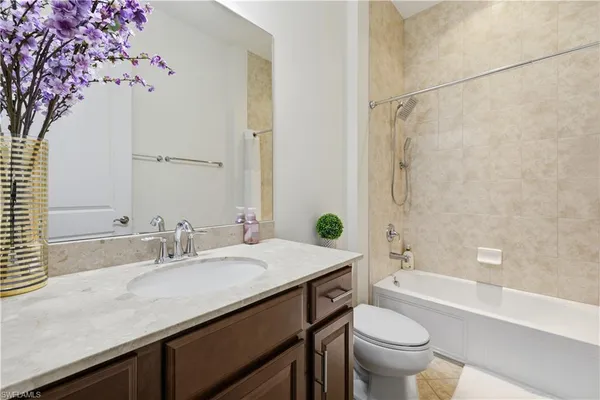 a bathroom with a sink a toilet and a bathtub