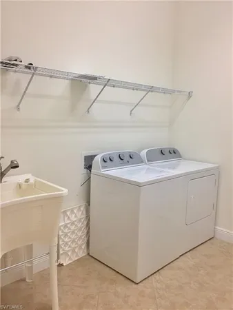 a front view of multi story residential apartment building with yard and green space