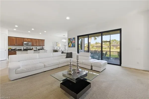 a living room with furniture and a large window