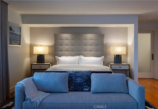 a living room with furniture and a lamp