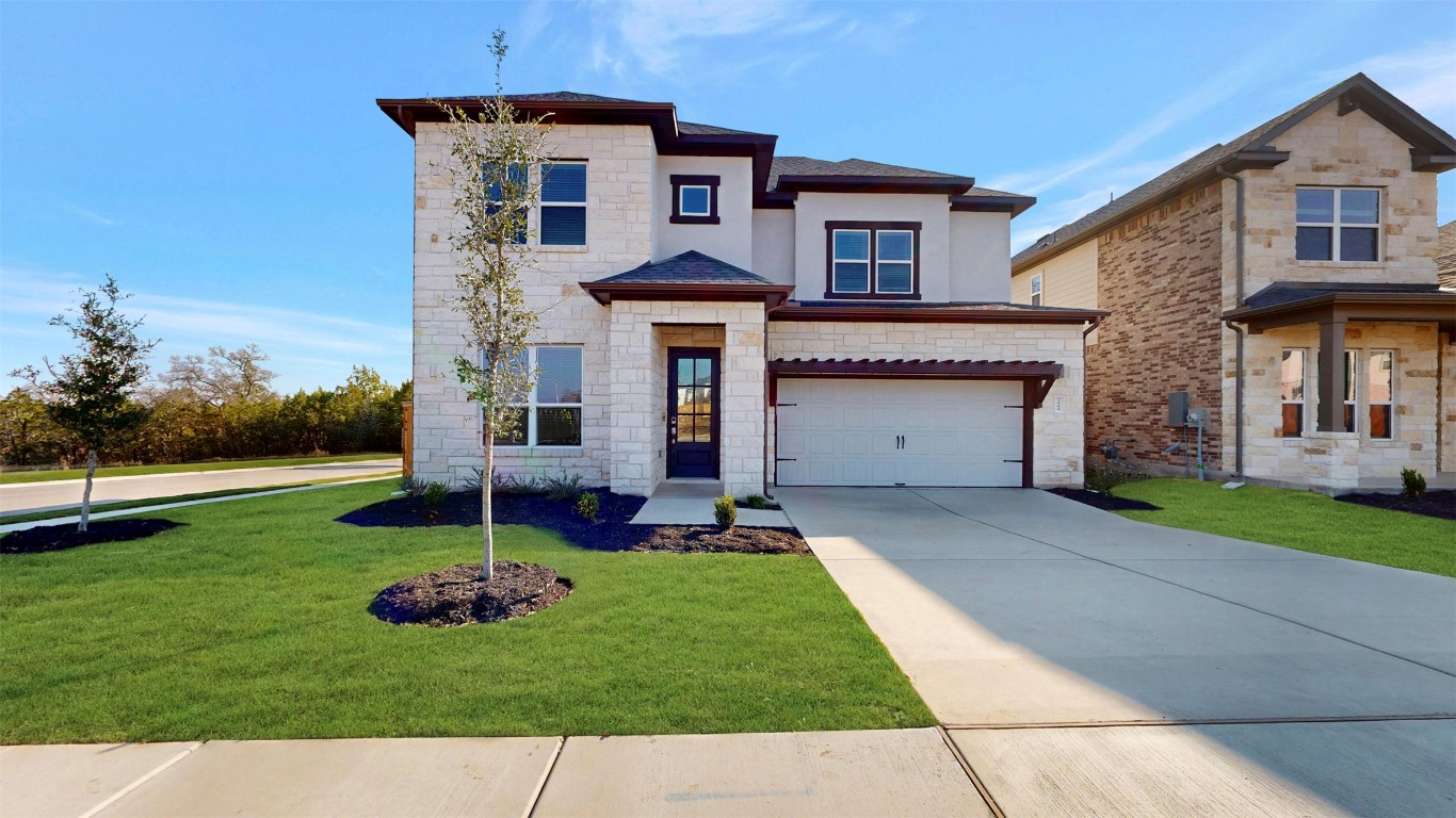 front view of a house with a yard