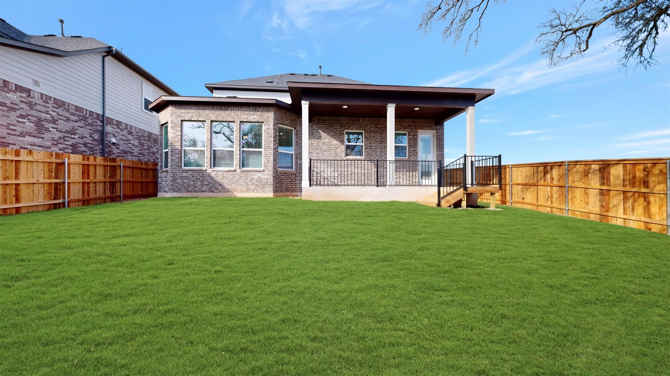 3944 Fulton Drive Leander, TX 78641 - Photo 19 of 23 a view of a house with a yard and sitting area
