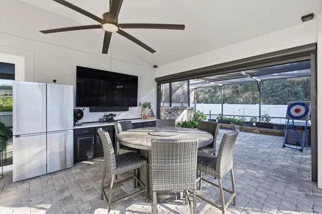 a view of a dining room with furniture window and outside view