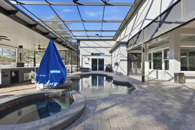 a view of swimming pool with seating space