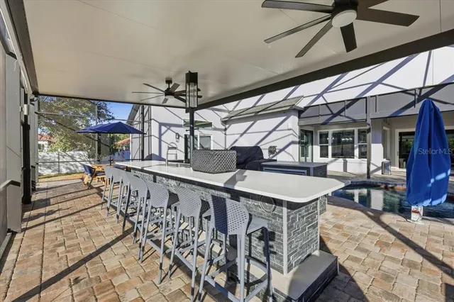 a view of a patio with table and chairs with wooden floor