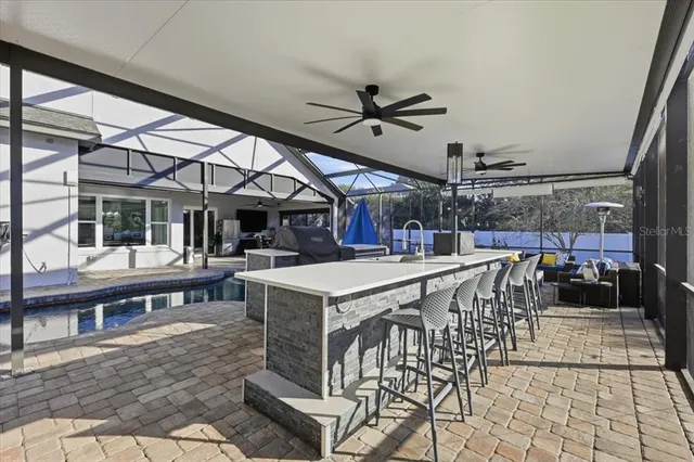 a view of a patio with a table and chairs