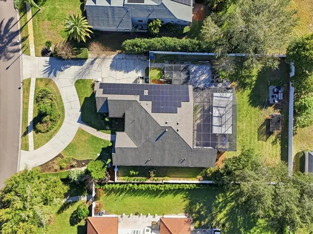 an aerial view of a house with a swimming pool