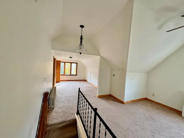 a view of a hallway with an entryway