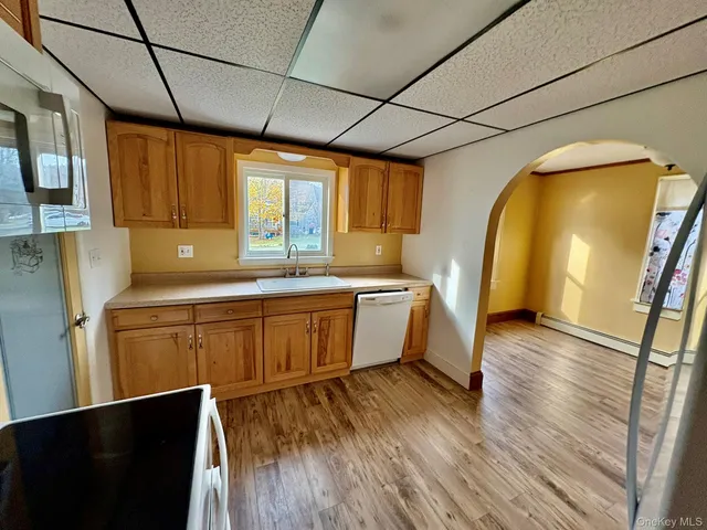 a utility room with sink dryer and washer