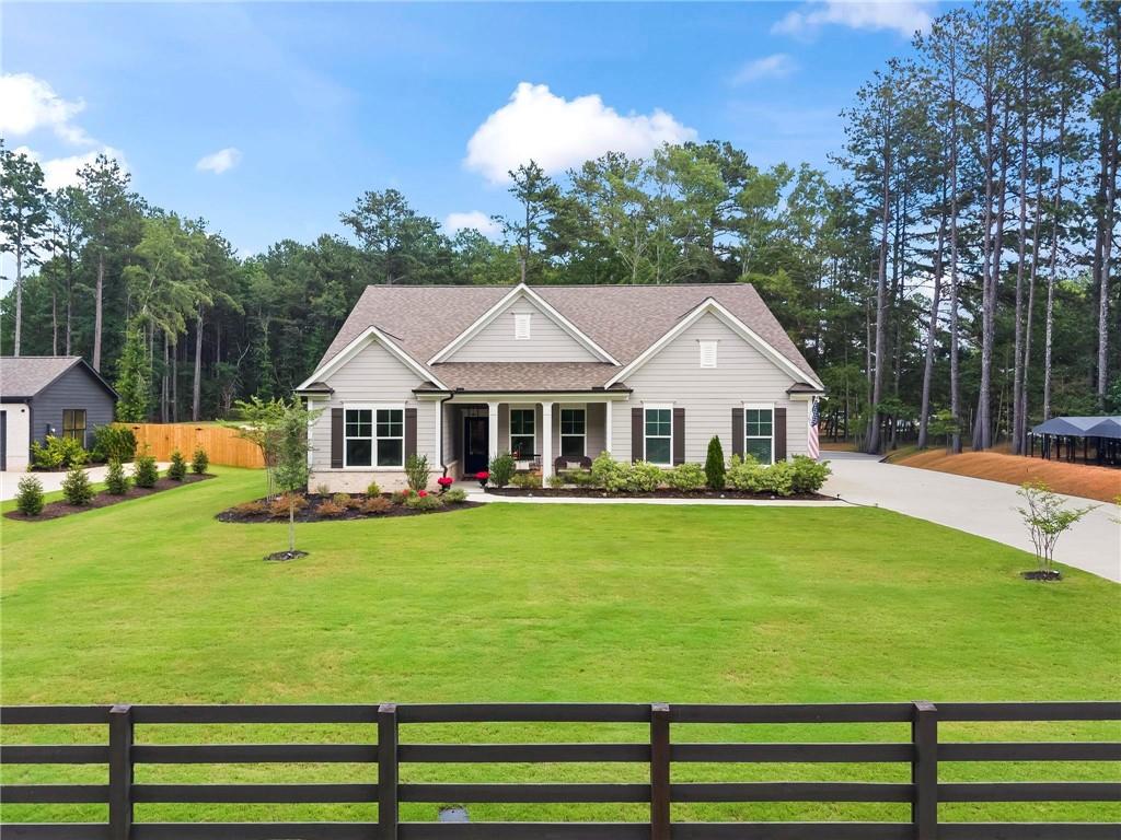 2081 Nunnally Farm Road Monroe, GA 30655 - Photo 2 of 44 a front view of a house with garden