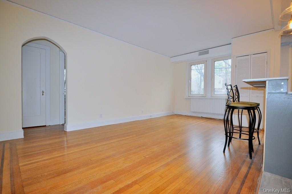 69 Harney Road, Unit 3A Scarsdale, NY 10583 - Photo 4 of 22 Large Living Room, with refinished hardwood floors, opens to the kitchen.