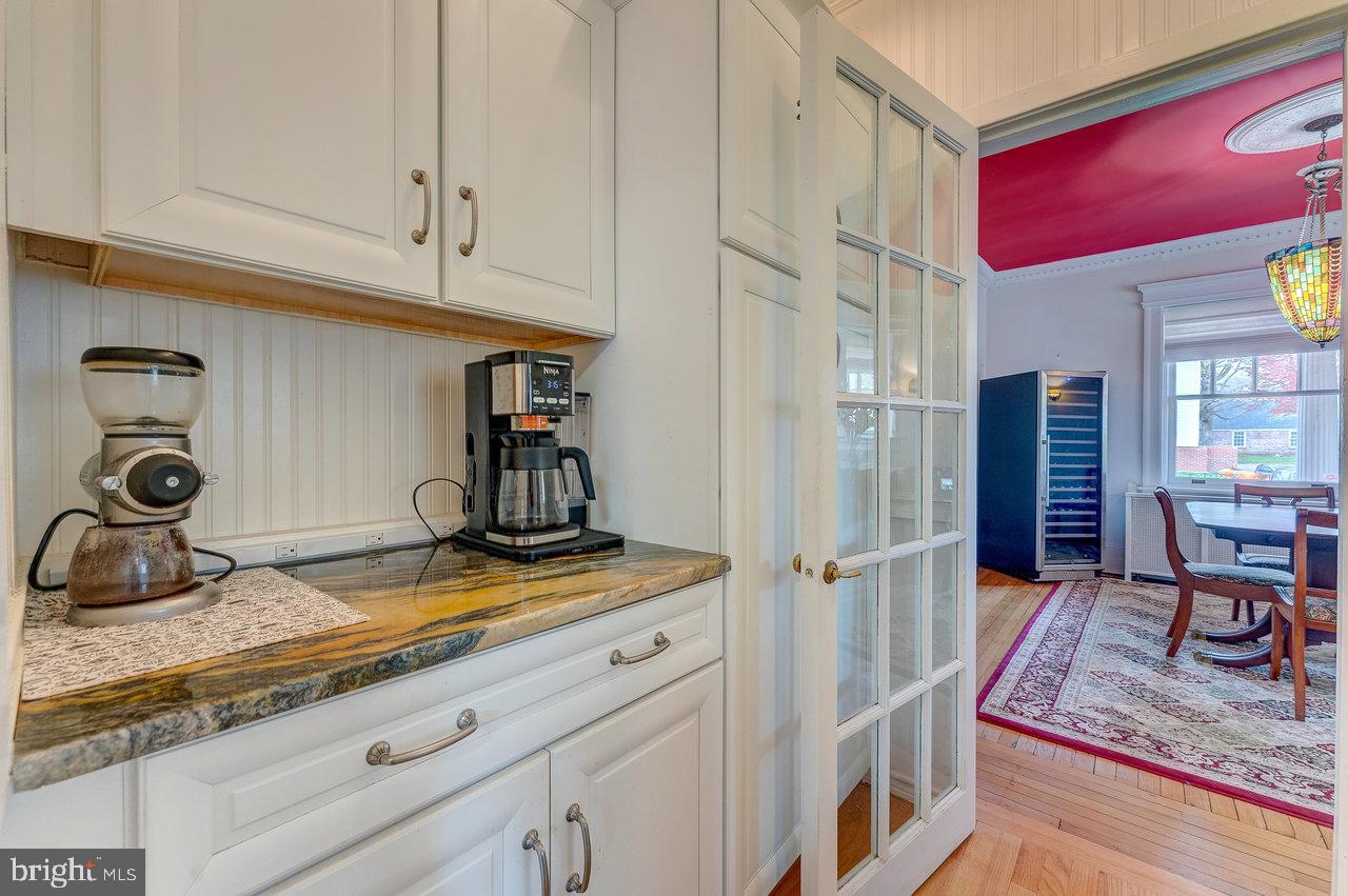 925 Berkeley Avenue Trenton, NJ 08618 - Photo 15 of 36 a kitchen with stainless steel appliances granite countertop a stove and white cabinets