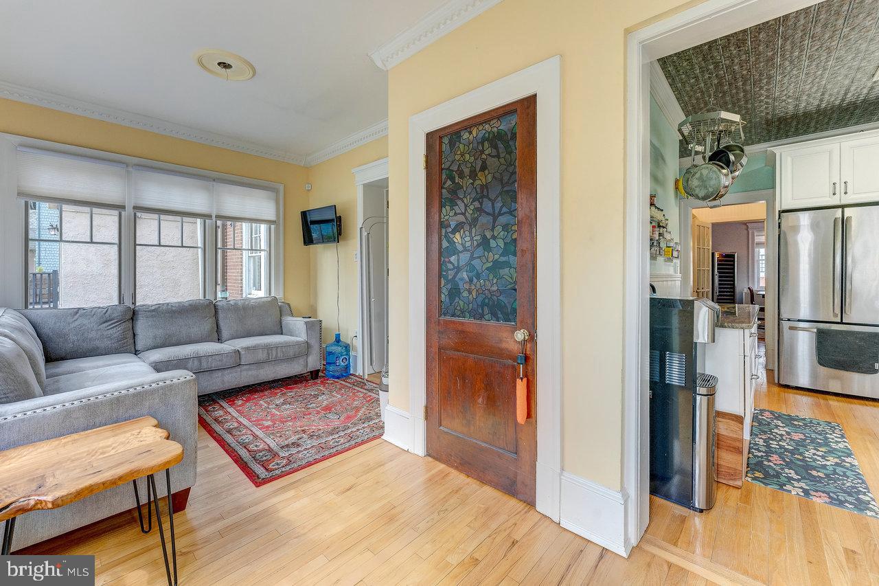 925 Berkeley Avenue Trenton, NJ 08618 - Photo 18 of 36 a living room with furniture and a window