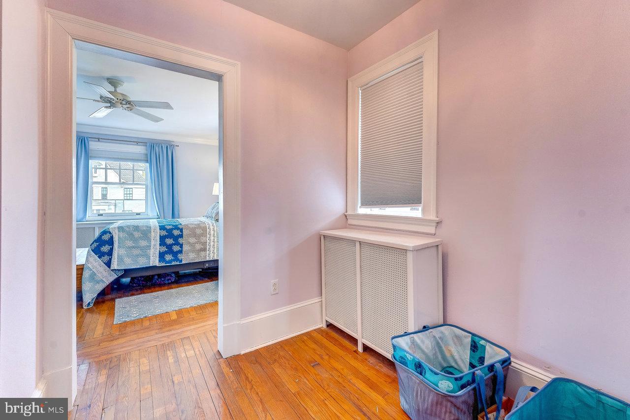 925 Berkeley Avenue Trenton, NJ 08618 - Photo 21 of 36 wooden floor in a gallery with living room