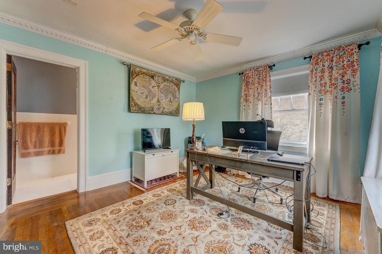 925 Berkeley Avenue Trenton, NJ 08618 - Photo 24 of 36 a living room with furniture and a flat screen tv