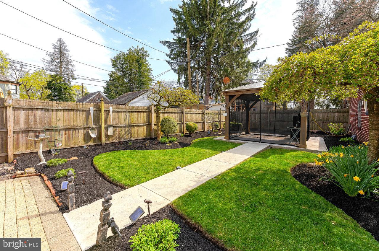 925 Berkeley Avenue Trenton, NJ 08618 - Photo 28 of 36 a view of a house with backyard and a tree