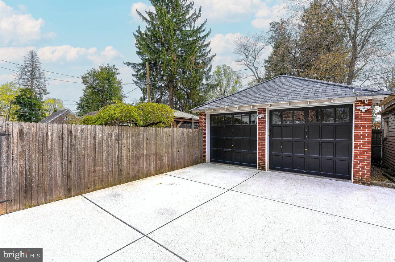 925 Berkeley Avenue Trenton, NJ 08618 - Photo 32 of 36 a front view of a house with a garage