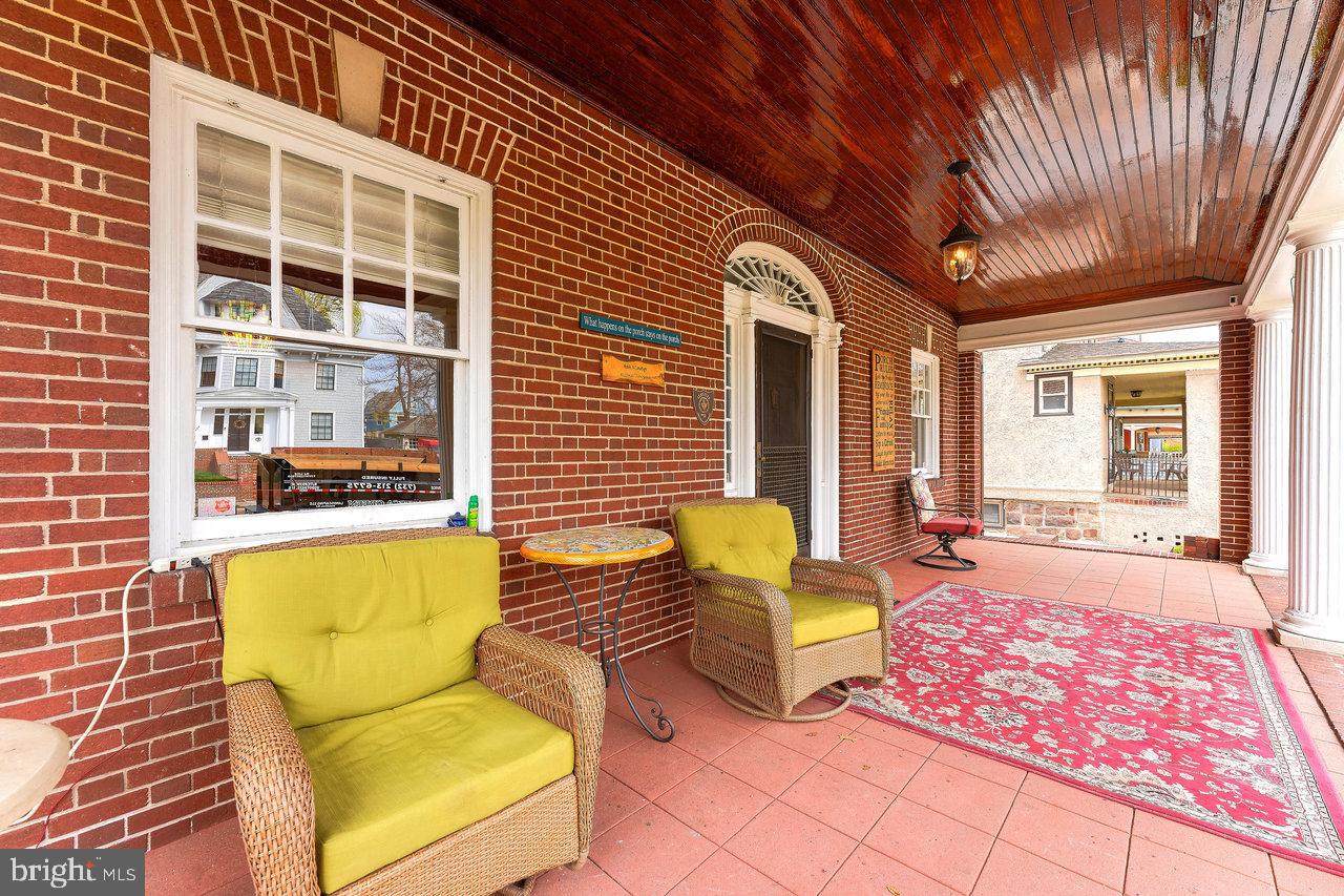 925 Berkeley Avenue Trenton, NJ 08618 - Photo 4 of 36 a view of a patio with couches chairs and potted plants