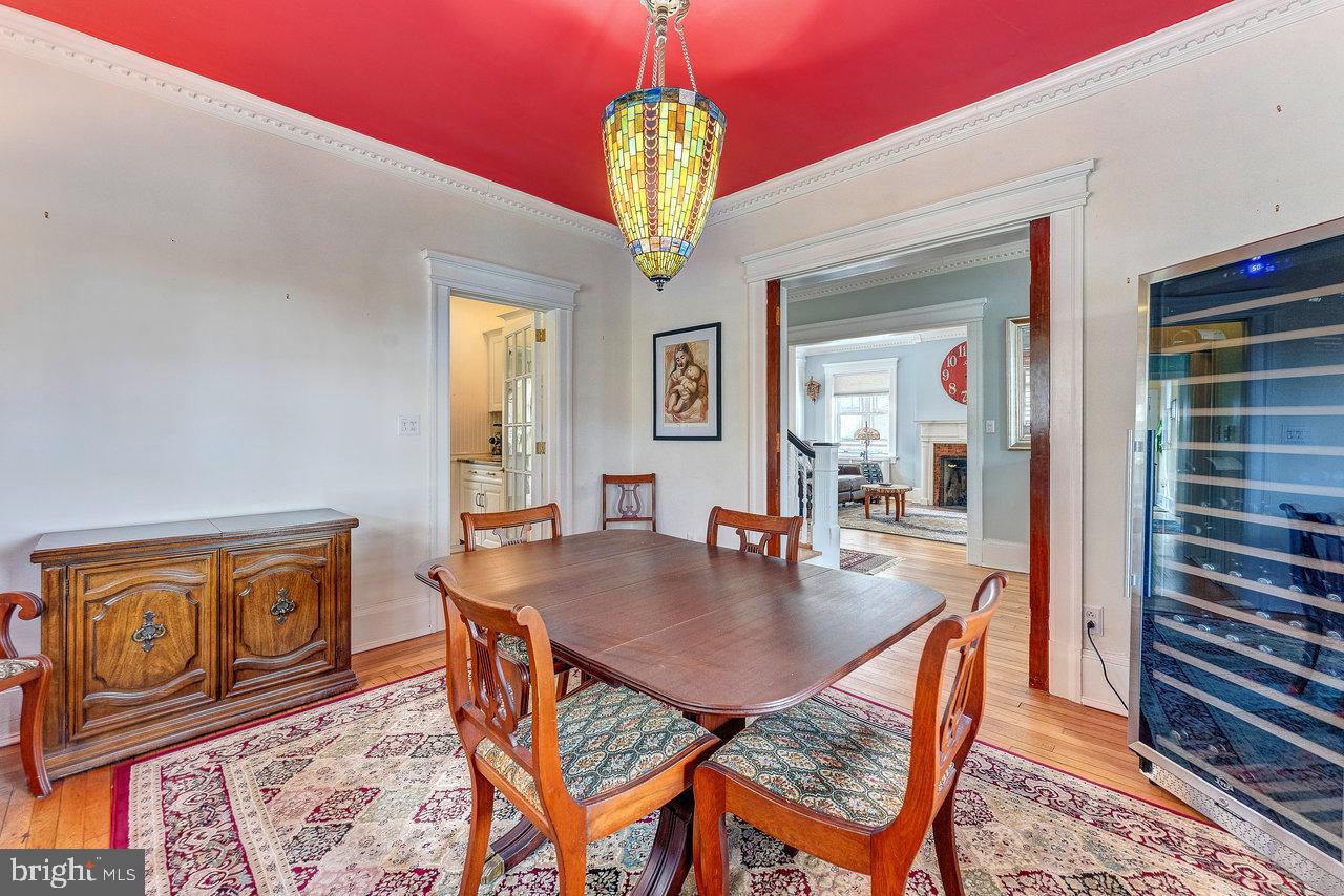 925 Berkeley Avenue Trenton, NJ 08618 - Photo 10 of 36 a dining room with furniture a rug and a chandelier