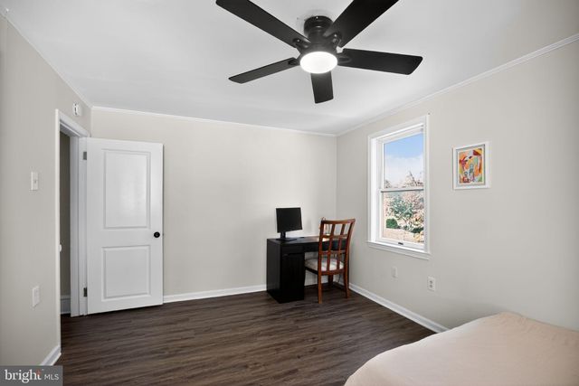 a bathroom with a granite countertop sink and a vanity