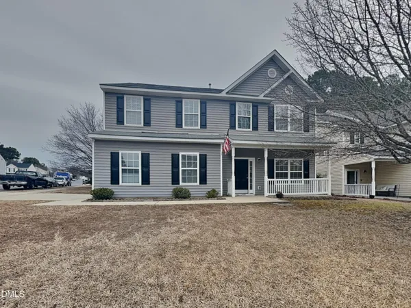 front view of a house with a yard