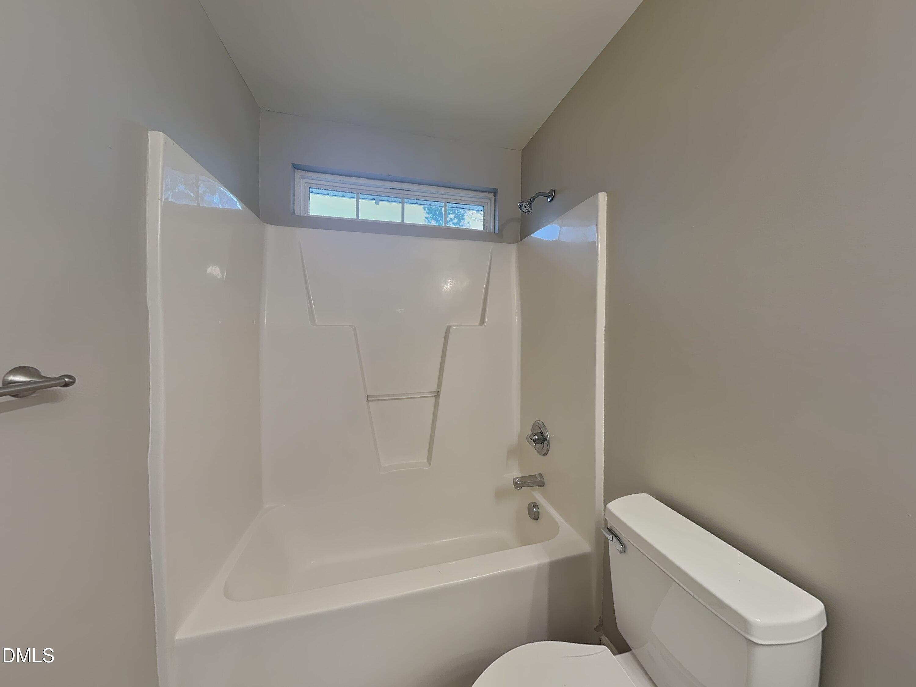 3101 Rendezvous Drive Raleigh, NC 27610 - Photo 16 of 18 a bathroom with a toilet and a bathtub