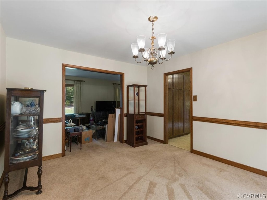 1614 Blakely Road Crozier, VA 23039 - Photo 11 of 33 a view of a livingroom with a furniture chandelier and a window