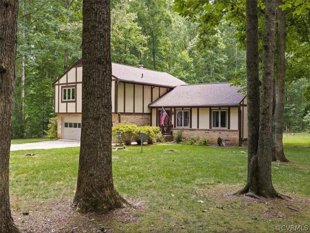 1614 Blakely Road Crozier, VA 23039 - Photo 2 of 33 a front view of a house with garden