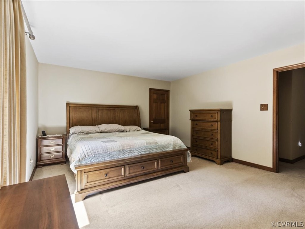 1614 Blakely Road Crozier, VA 23039 - Photo 21 of 33 a bedroom with a bed and a cabinets