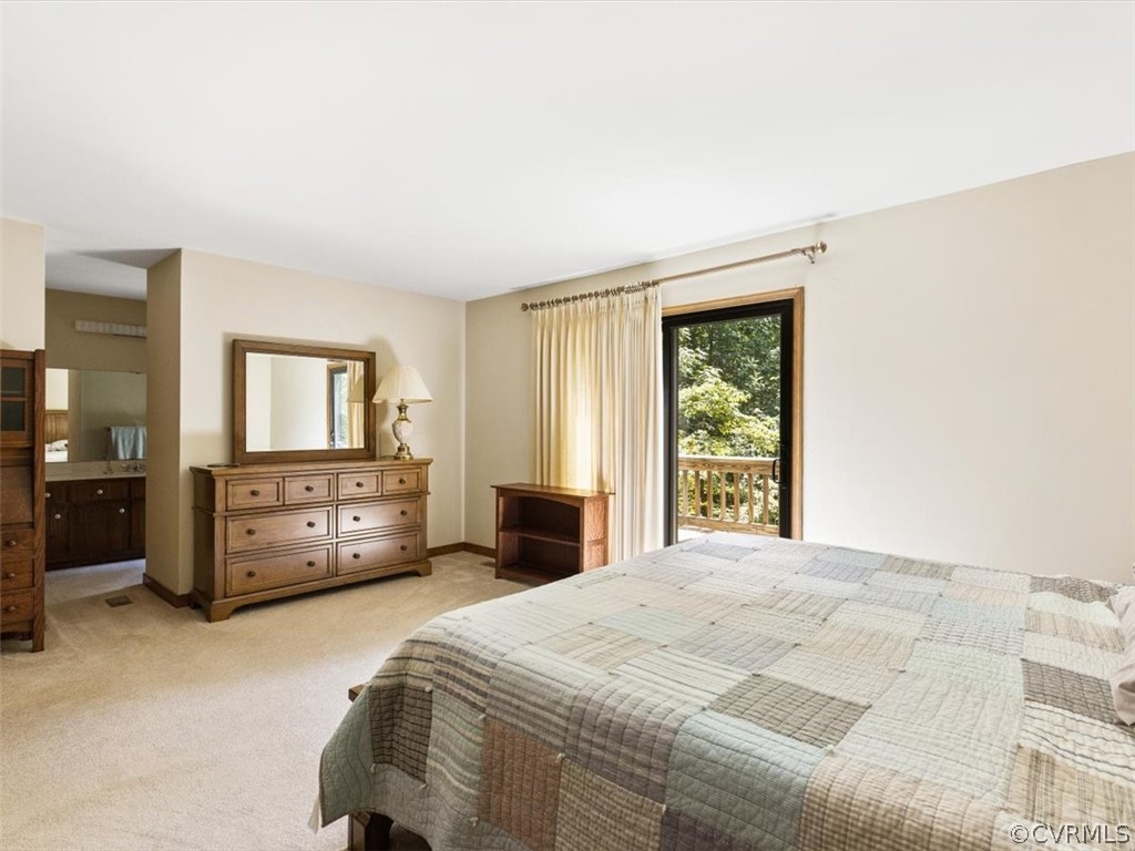 1614 Blakely Road Crozier, VA 23039 - Photo 22 of 33 a spacious bedroom with a bed and a window