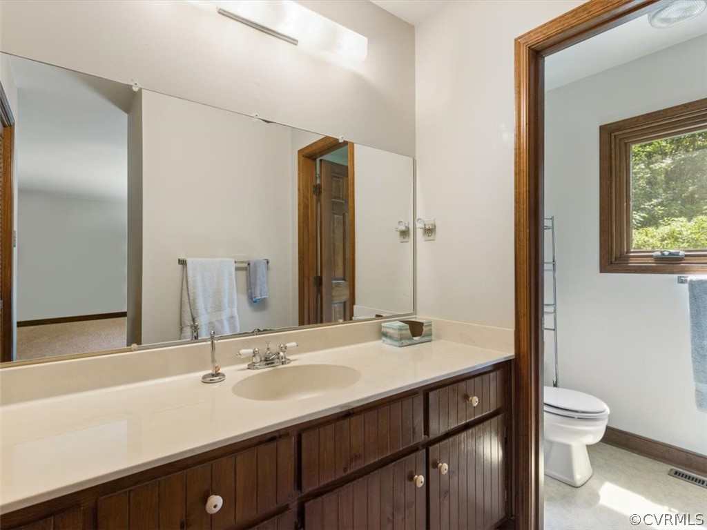 1614 Blakely Road Crozier, VA 23039 - Photo 23 of 33 a bathroom with a sink and a mirror