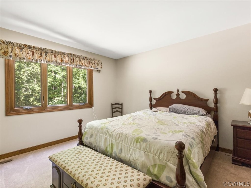1614 Blakely Road Crozier, VA 23039 - Photo 27 of 33 a bedroom with a bed and a window