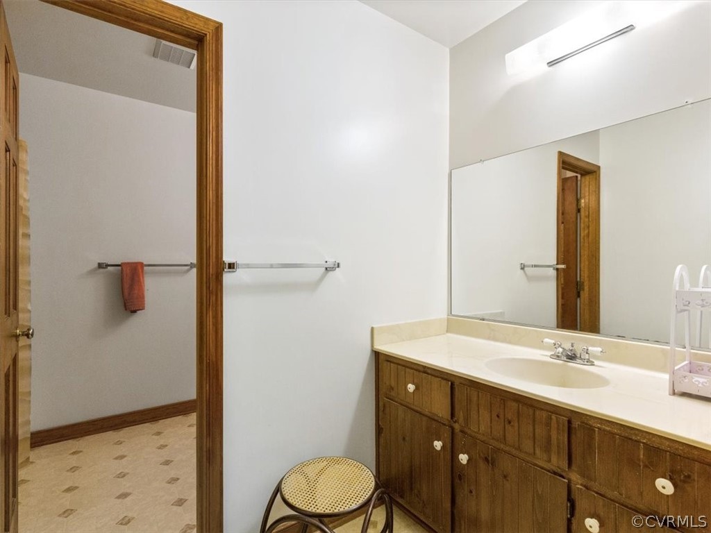 1614 Blakely Road Crozier, VA 23039 - Photo 28 of 33 a bathroom with a sink a toilet and shower