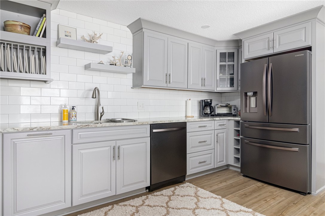 5390 Post Road, Unit 4 East Greenwich, RI 02818 - Photo 12 of 35 Recessed lighting, attractive flooring and upgraded fixtures. It's also fully equipped with fingerprint resistant, stainless steel appliances.