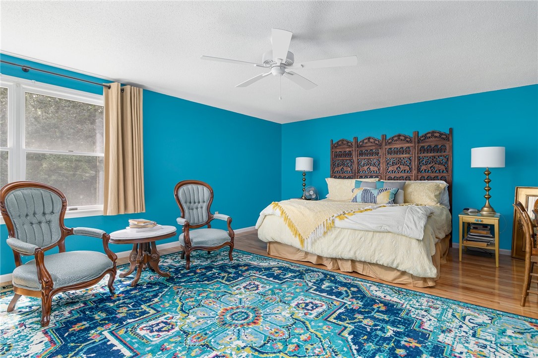 5390 Post Road, Unit 4 East Greenwich, RI 02818 - Photo 20 of 35 The huge master bedroom feels like a junior suite and also features hardwood floors.