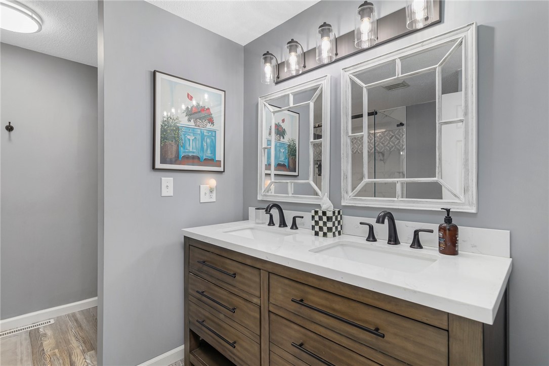 5390 Post Road, Unit 4 East Greenwich, RI 02818 - Photo 22 of 35 This stunning master bathroom was also recently renovated and offers double sinks and upgraded lighting.