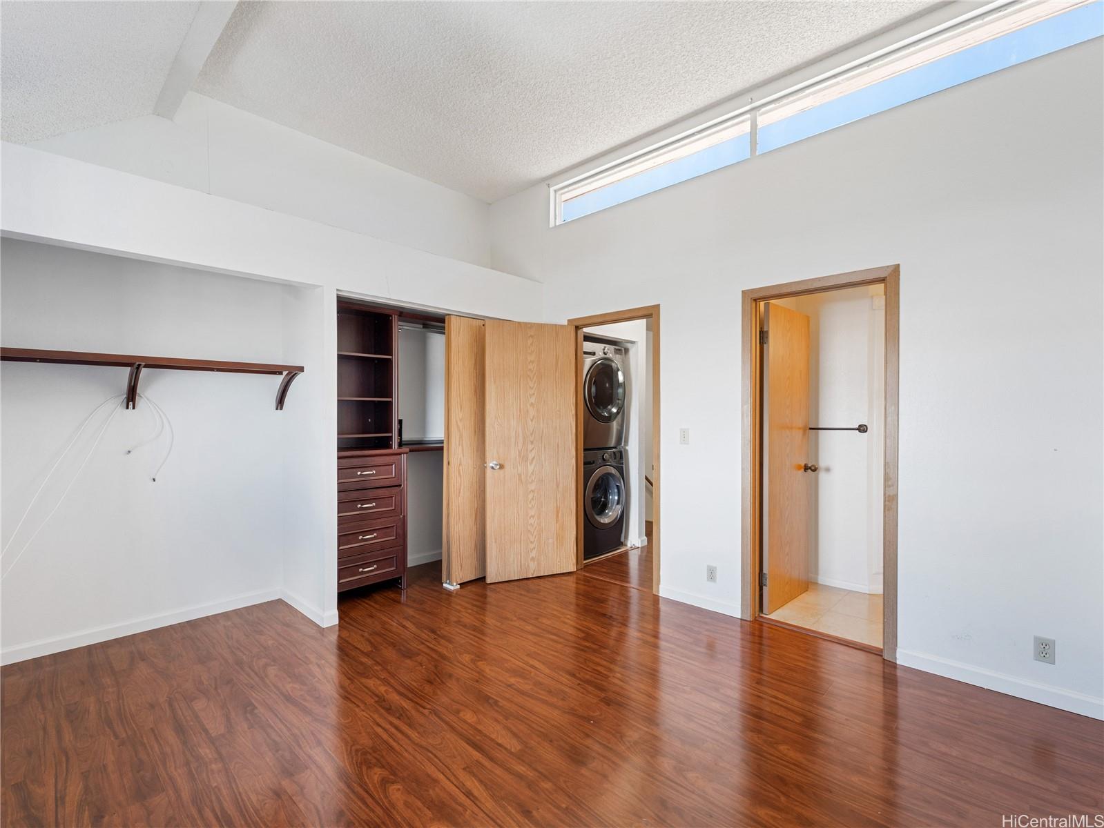 98-941 Moanalua Road, Unit 403 Aiea, HI 96701 - Photo 11 of 25 a view of a room with wooden floor and entryway
